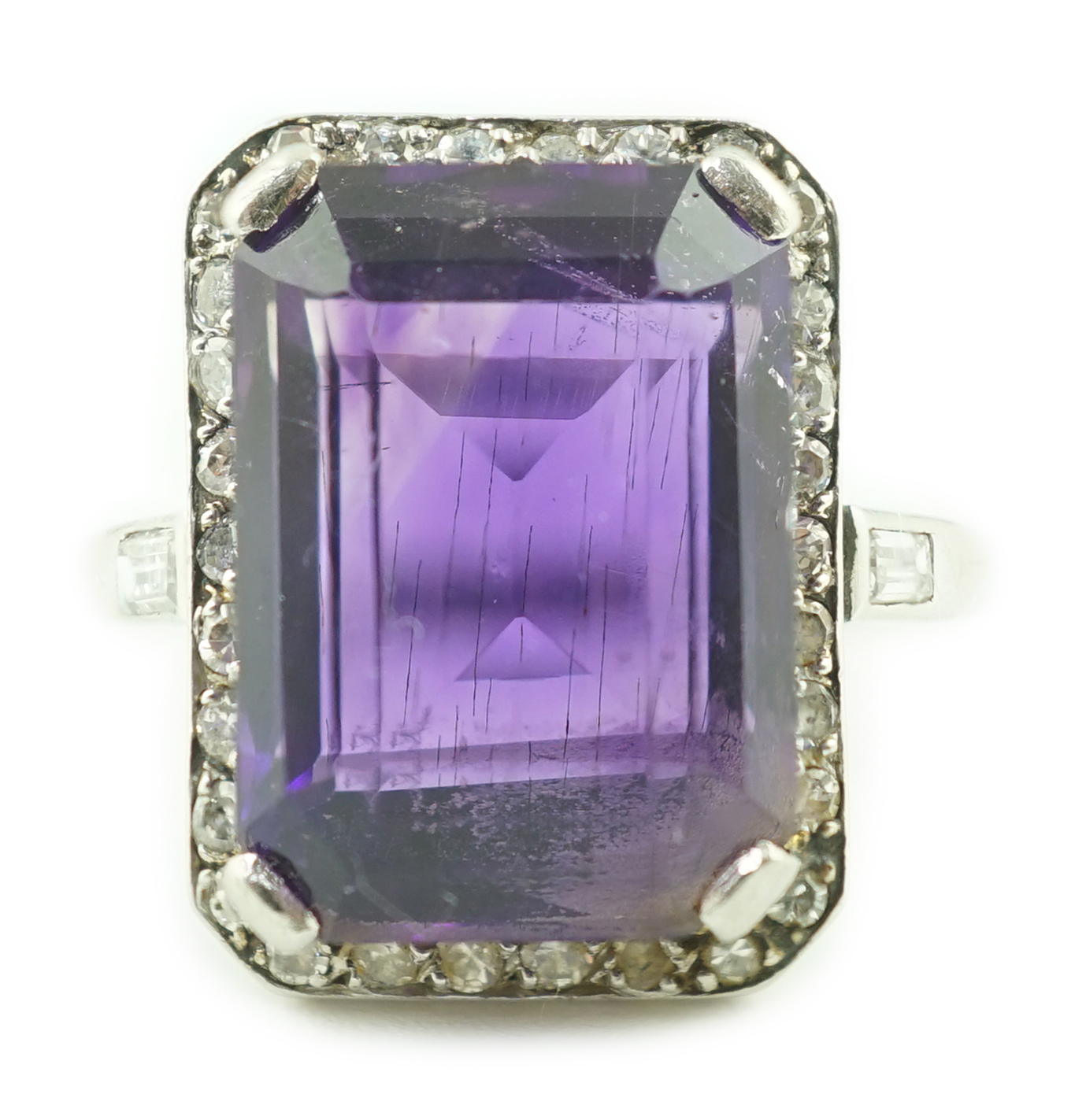 A mid 20th century platinum?, amethyst and diamond set cluster ring